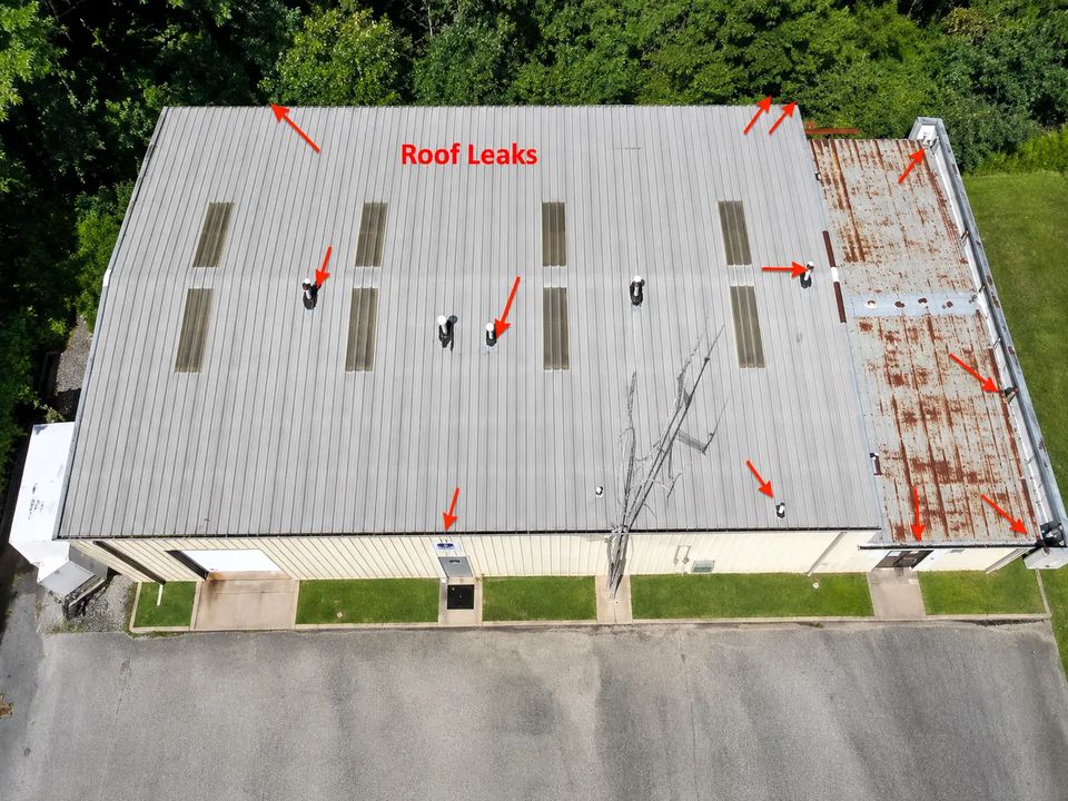 Rusted commercial metal roof in Bloomington, Indiana before a metal roof coating system was applied