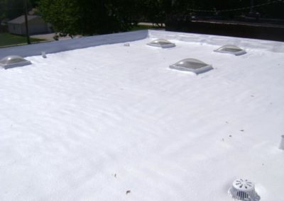 Foam roof with white top coat