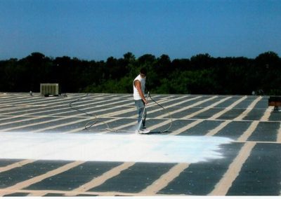 TPO roof being sprayed with top coat in IL
